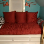 Two outside red pillows are reversible - either plain or with patterned inset and black polka dot trim