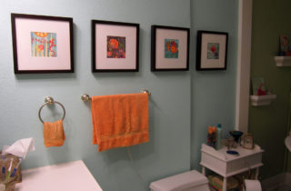 Moved the towel bar and towel ring, and added four of my framed watercolors