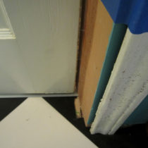 Other side of flooring that was cut too much, and the non-square door jamb.